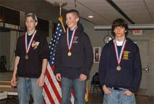 The top Sporter Individuals of Day One were Deckard Day (middle) of LaCueva HS, NM, MCJROTC, Wil­liam Eades III, (right), CE Byrd HS, LA, AJROTC, and Christopher Potts (left), Buckhorn HS, AL, AJROTC.