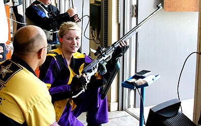 FORT BENNING, Ga.--Kelsey Hansen, 16, from Minot, N.D., listens to instructions from Sgt. Michael McPhail (standing) and Staff Sgt. Shane Barnhart of the U.S. Army Marksmanship Team June 25. Hansen was among 35 junior shooters who participated in the AMU's Junior Rifle camp June 22-26 here.  (Photo by Michael Molinaro, USAMU PAO)