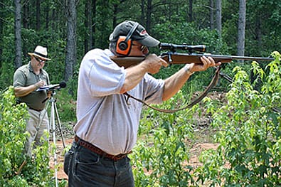 SC Range Grant (Brian Hyder and John Joines).jpg: Brian Hyder (front), NRA Eastern Regional Director, shoots at the future Belfast WMA range site, while John Joines from NRA Range Services measures the sound pressure. (Photo by Justin McDaniel)