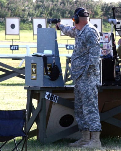 CAMP PERRY, Ohio--Sgt. 1st Class James Henderson, U.S. Army Marksmanship Unit, fires on a target during an individual match at the National Pistol Championships July 18. Henderson won the Individual National Pistol Championship, the first time a Soldier from the active duty Army has won the coveted award since 1985. (Photo by Michael Molinaro, USAMU PAO)