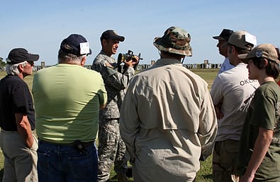 CAMP PERRY, Ohio--Sgt. Nathan Verbickas, U.S. Army Marksmanship Unit, goes over the M16A2 rifle with a group of students at the Small Arms Firing School Aug. 1. Close to 700 civilians participated in the rifle class while another 500 took part in the pistol class. (Photo by Michael Molinaro, USAMU PAO)