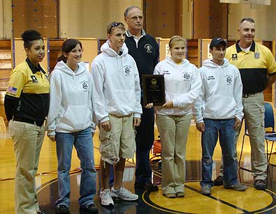 SAN ANTONIO--U.S. Army Marksmanship Soldiers Sgt. 1st Class Janet Sokolowski and Sgt. 1st Class Mike Moore pose with students from Bogalusa, La. High School Oct. 11. The USAMU held a clinic for junior shooters in San Antonio Oct. 9-11, one of hundreds the NCOs from the USAMU conduct annually throughout the country.