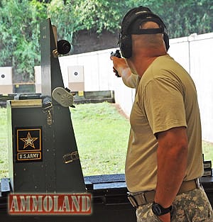 FORT BENNING, Ga. -- Sgt. 1st Class James Henderson, U.S. Army Marksmanship unit, fires at a target June 16 at Phillips Range during the 52nd Interservice Pistol Championships. Henderson won the overall individual championship and was also a member of the team champions, U.S. Army Blue. He set a new match record and won his seventh title at the competition. (Photo by Michael Molinaro, USAMU PAO)