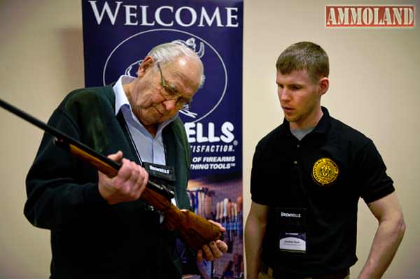  Legendary custom gunmaker Jerry Fisher examines a student's work at GCCF 2013.