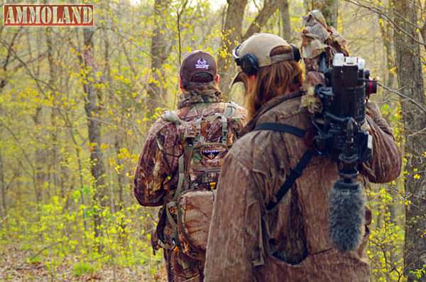 Salter and Miller watch and listen for clues on the best way to set-up for and call to turkeys on an adjacent ridge.