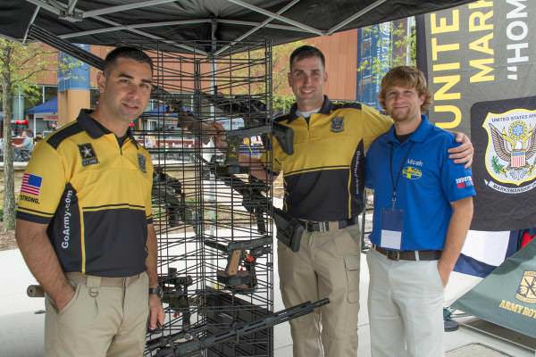 Christopher Ortega and Joshua Richmond from the AMU and Micah Mcmillan, Mossberg's exhibition shooter.