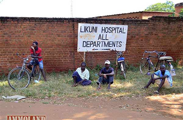 Bicycle taxi drivers waiting for passengers outside of a hospital in poor but peaceful Malawi