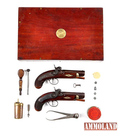 Walnut-cased pair of London pocket pistols, crafted along the lines of those made by Henry Deringer, est. $3,500-$4,500. 