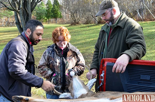 Northern Michigan University students check in a deer in Marquette