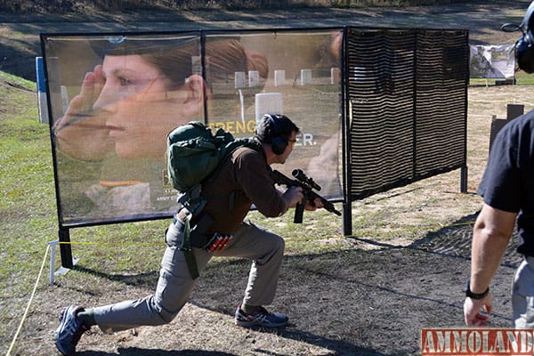 Sgt. 1st Class Matthew Merced, Master Marksmanship Training Course instructor, C Company, 1st Battalion, 29th Infantry Regiment, 316th Cavalry Brigade, Maneuver Center of Excellence, sprints around a barrier during the 2015 Fort Benning Multi-gun Challenge. Service members and civilians attended the three-day event Dec. 4-6 at Krilling Range, where many got a taste of Army training they may not have experienced before.