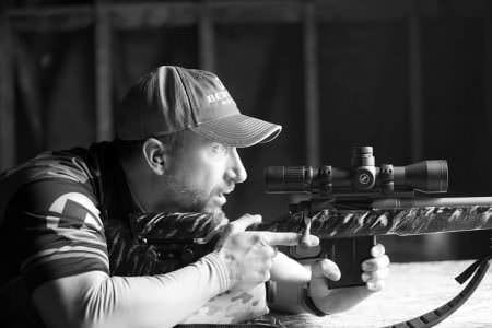 Dan Hanus at the range with one of his custom rifles.