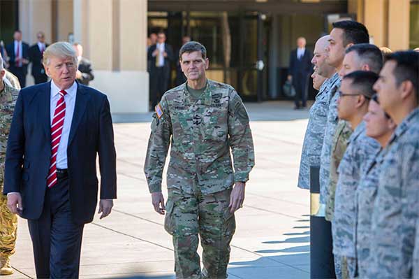 President Donald J. Trump and Army Gen. Joseph L. Votel, commander of U.S. Central Command, spend a few minutes with troops on their way to today's press briefing at MacDill Air Force Base, Fla., Feb. 6, 2017. President Trump visited Centcom headquarters to discuss issues relevant to the commandâ€™s area of responsibility. U.S. Central Command photo by Marine Corps Sgt. Alan Belser