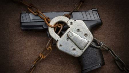 Locked Chained Gun Firearms Ban AdobeStock_95690334