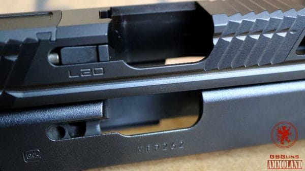 L2D Combat Glock Replacement Slide with Expanded Ejection Port, note OEM Glock Slide Below