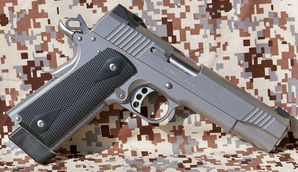 Modern 1911 handgun with a matt stainless finish