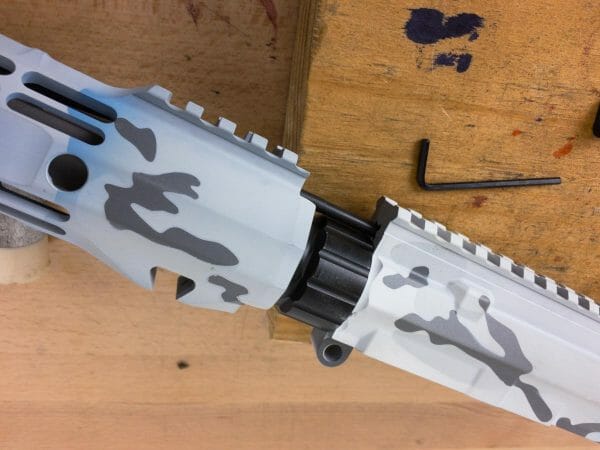 Slide the handguard into place over the barrel nut.