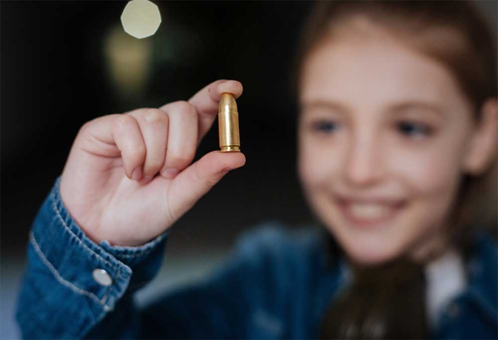 Kids Girl Youth Shooting Range Ammunition Bullet 9mm istock yacobchuk 664943430