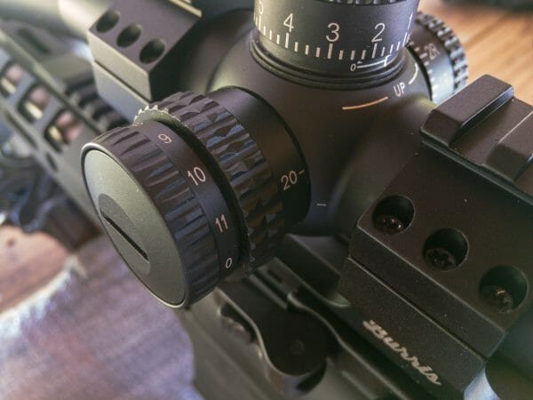 Vortex Strike Eagle 4-24x50 Rifle Scope: On the left is a turret with the focus / parallax adjustment dial. The outer knob turns on and adjusts the illuminated reticle.