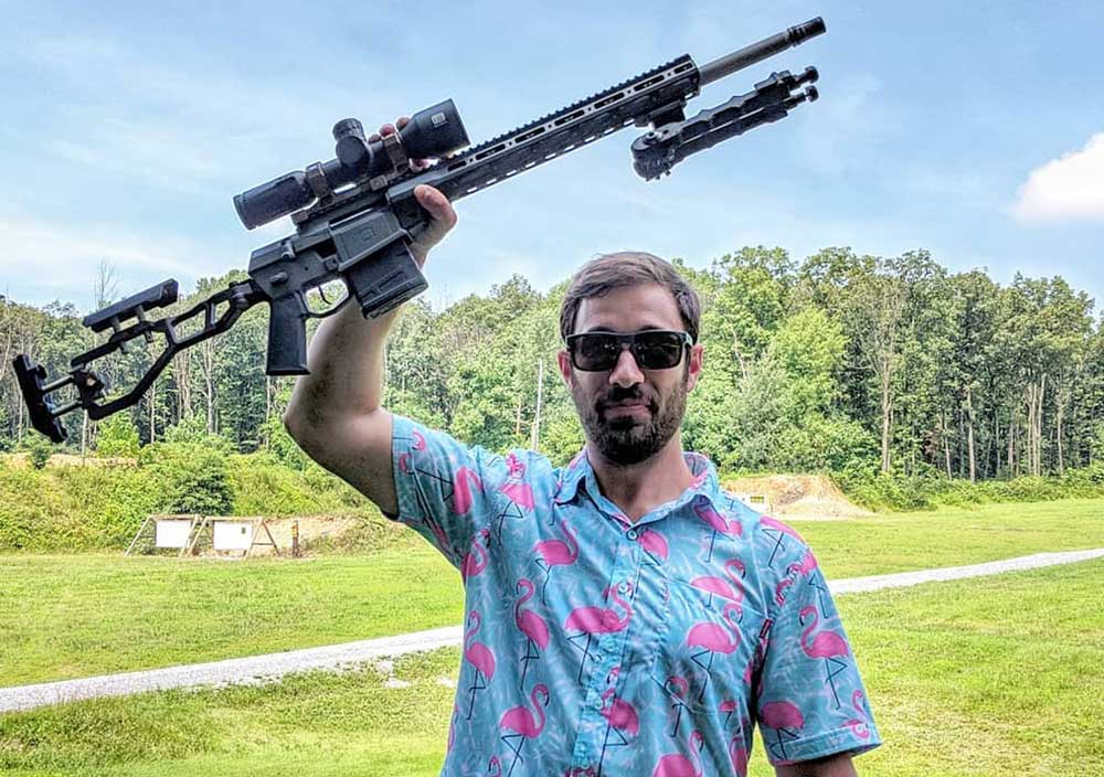 Adam Kraut with Rifle