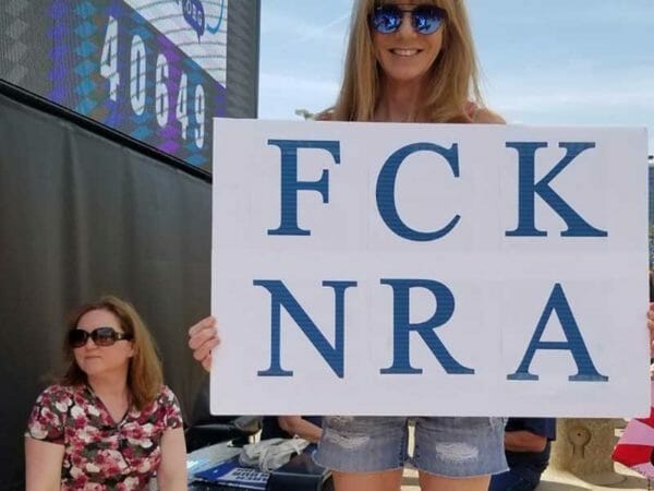 Proud NRA Protestor with Vulgar Sign Cropped