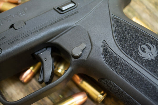 The Ruger Security 9 Pistol magazine release button is small but I could easily operate it without changing my firing grip.