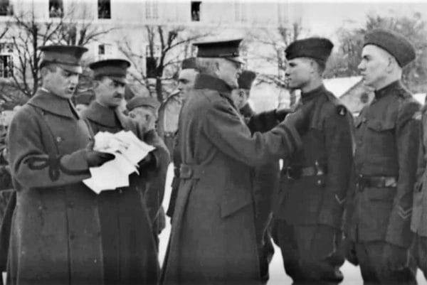 Army Gen. John Pershing pins the Medal of Honor to recipient Pfc. Charles Barger during a ceremony for several soldiers at his headquarters in Chaumont, France, on Feb. 7, 1919.