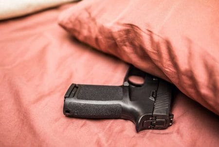 Home Defense Gun Hidden Under Pillow iStock-GummyBone-937150766