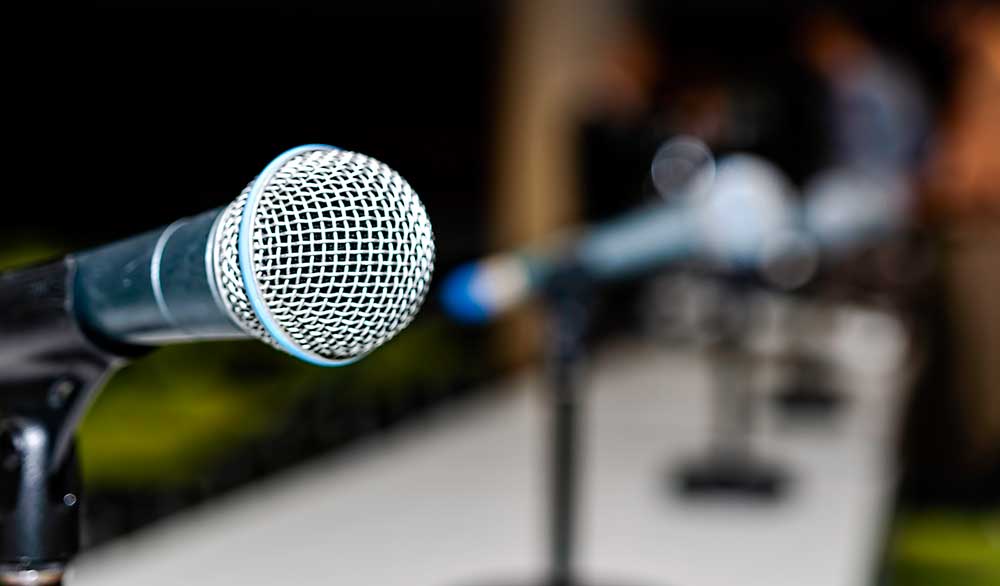 Microphone on a table, Announcement, Statement iStock-sfe-co2-1139364764.jpg