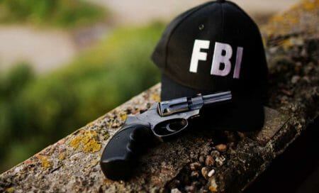 FBI cap Handgun revolver iStock-ASphotowed 859570532.jpg