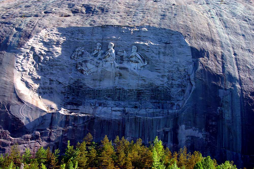 As Santayana warned, “Those who cannot remember the past are condemned to repeat it.” And those who would destroy those memories are bent on being the new slave masters. (Stone Mountain Park/Facebook), iStock-487527539