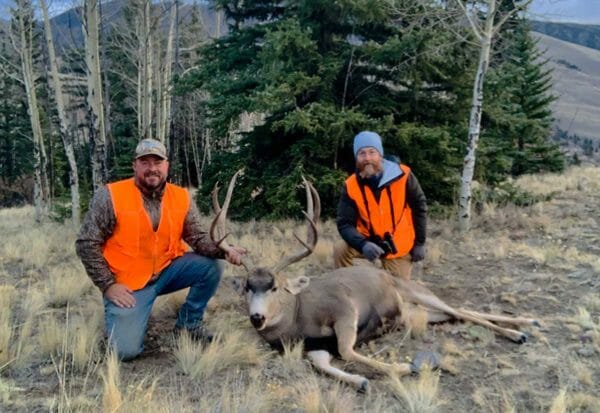 Brandon Butler and Jeremy James, are all smiles with Brandon’s Colorado mule deer.