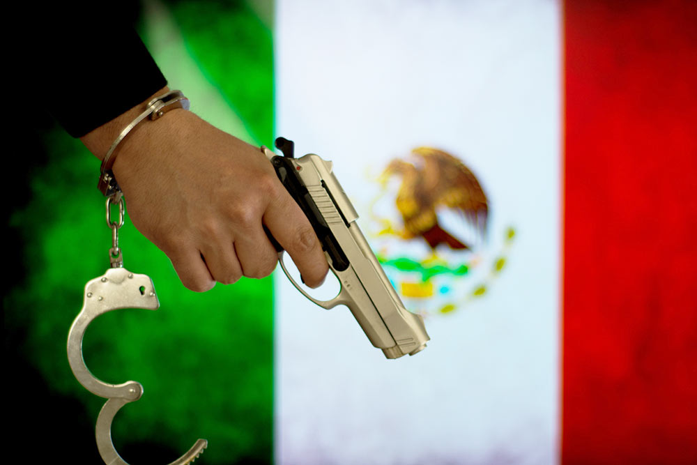 Flag of Mexico Penal Rifle iStock-683332844