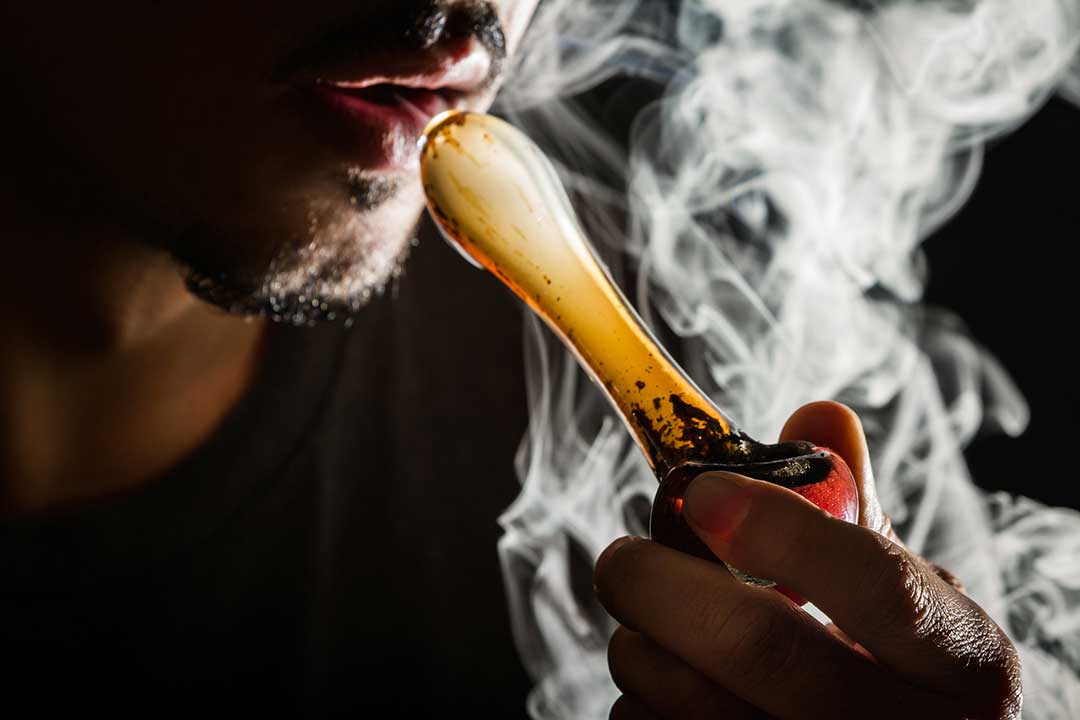 Smoking Cannabis Stock Photo iStock-Charles Wollertz 948307088