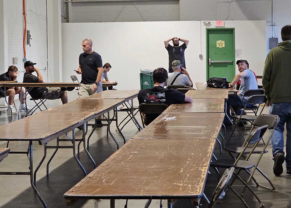 Frustrated, gun owners sit and wait up to nine hours for background check approvals at Syracuse gun show. Photo credit: Matt Mallory