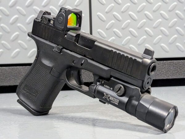 Glock 19 MOS w/ Trijicon RMR and SureFire X300. image Duncan Johnson