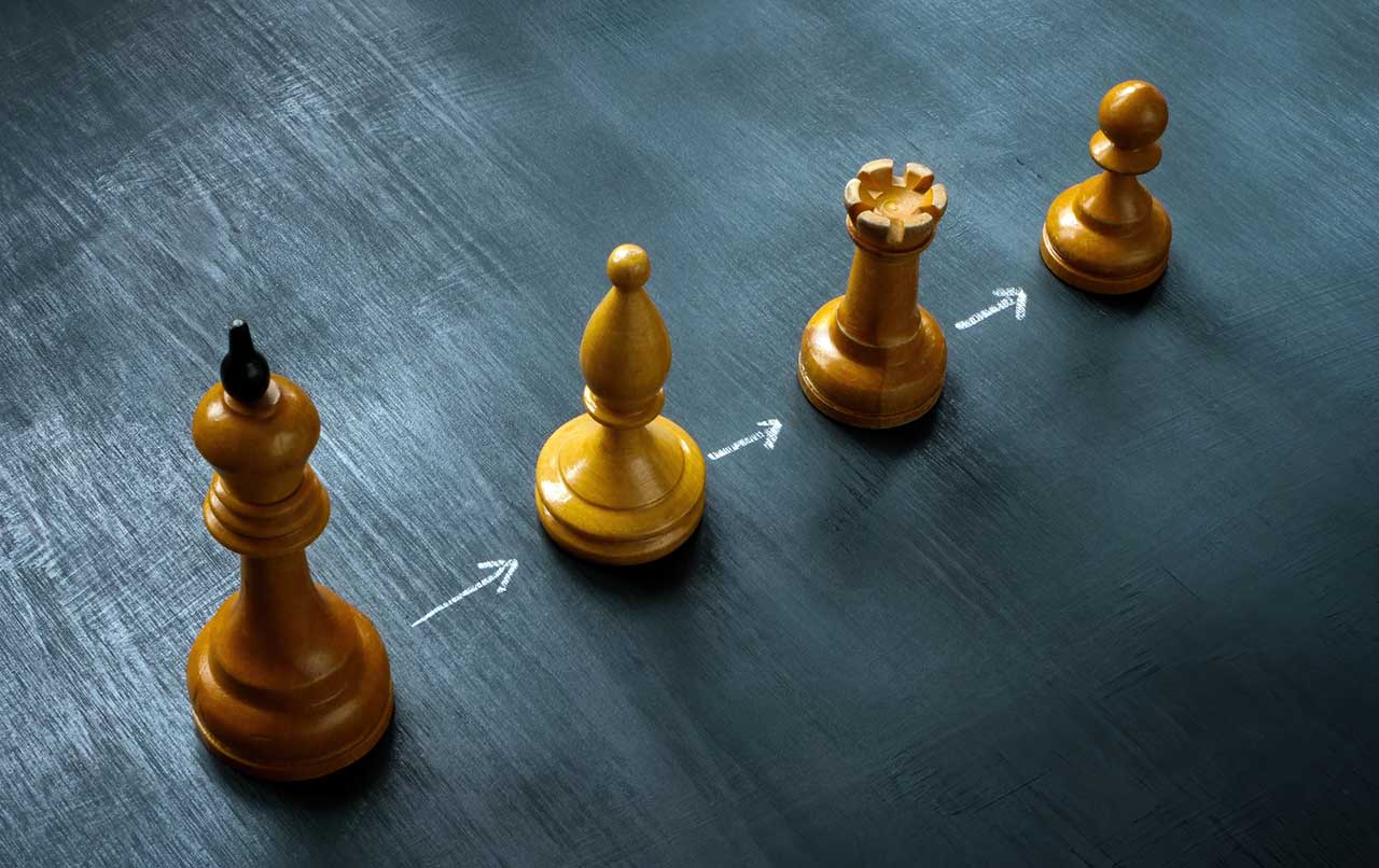 Continue Fighting Line of chess pieces and arrows iStock-designer491 1492416961