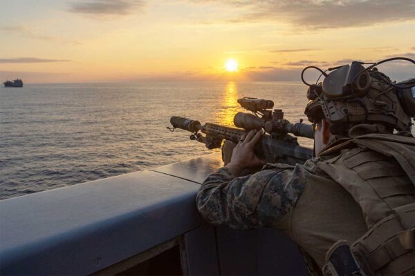 Scout sniper with Battalion Landing Team 1/1, 31st Marine Expeditionary Unit, observes the USS Miguel Keith (ESB 5) with a MK22 AS Photo by Cpl. Elijah Murphy