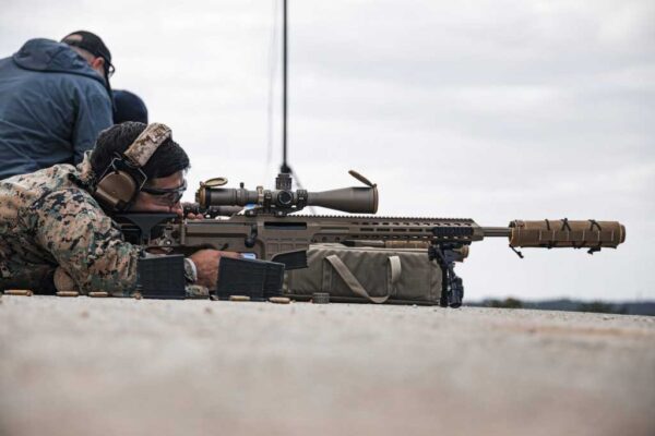 A U.S. Marine fires a MK 22 Advanced Sniper Rifle during a new equipment training range on Camp Schwab, Okinawa, Japan. (Photo by Cpl. Alex Fairchild)