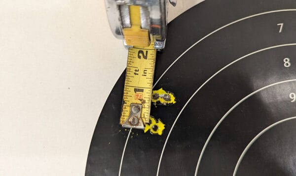 Five rounds fired with a vise at 100 yards with a Sabre 15 and 4x Prism optic.