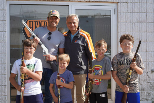 Anthony Imperato, owner of Henry, and Pete Hegseth formally of Fox News who is now the nomination for the Secretary of Defense and four of his children at the Henry Rifle factory in Rice Lake, Wisconsin.