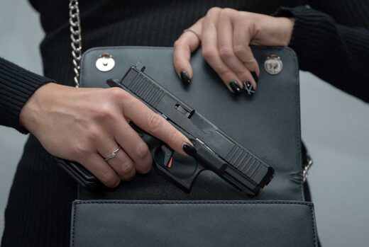 Women concealed carry handgun pistol in a purse iStock-Dmitri Toms 1609777611